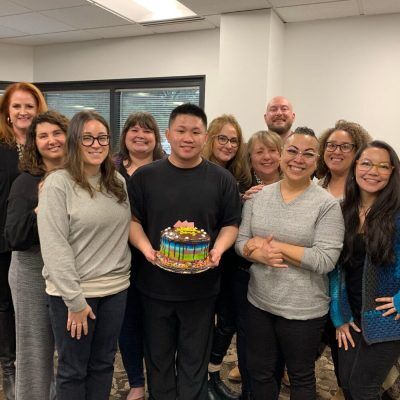 The Fedelta Home Care team poses for a photo to celebrate a birthday